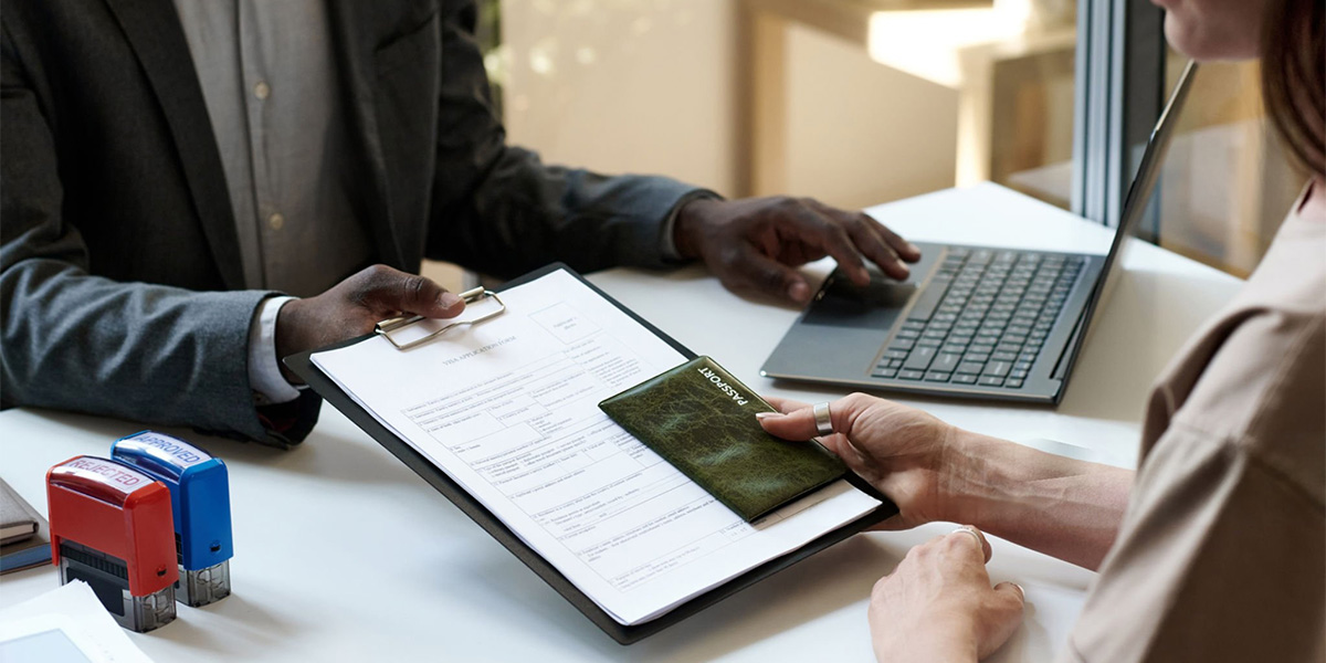 Student filling a study visa application form during visa interview preparation