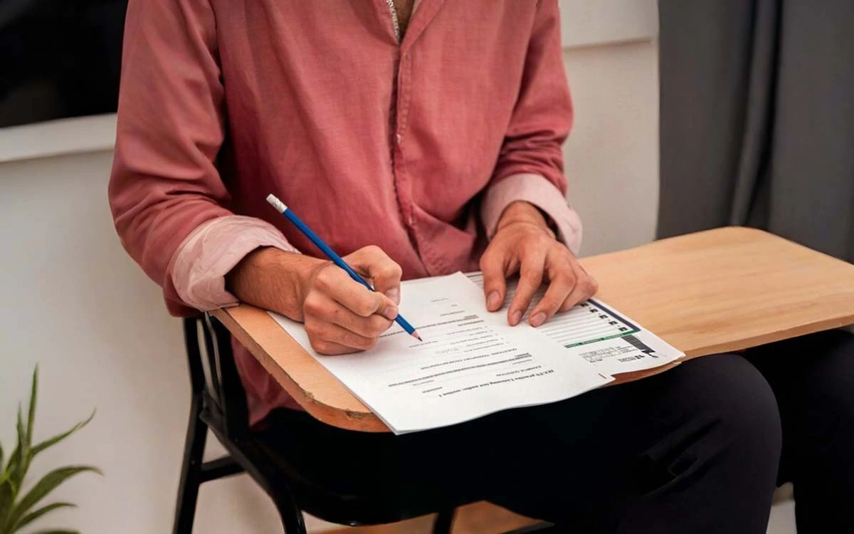 Student filling a study visa application form during visa interview preparation